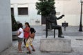 Unknown children at the monument to the famous Spanish singer flamenco Chano Lobato at the center of art `La Merced`in Cadiz.