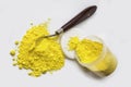 Cadmium Yellow pigment on a white background