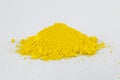 Cadmium Yellow pigment on a white background