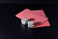 Cads and dice on black Royalty Free Stock Photo