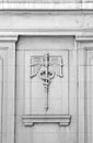 Caduceus bas-relief on vintage building exterior