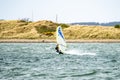 Caernarfon , Wales - May 01 2018 : Man windsurfing close to the town