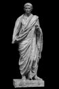 Caesar Octavianus Augustus roman emperor adopted son of Julius Caesar. Isolated statue on black