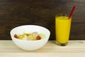 Caesar orange juice salad delicious healthy food tomatoes croutons Parmesan cheese and fresh mozzarella on wood background Royalty Free Stock Photo