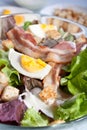 Caesar salad with bacon and eggs Royalty Free Stock Photo