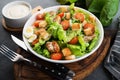 Caesar salad with chicken fillet, cherry tomatoes and croutons, traditional Italian food Royalty Free Stock Photo