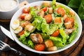 Caesar salad with chicken fillet, cherry tomatoes and croutons, traditional Italian food Royalty Free Stock Photo