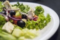 Caesar salad with chicken fillet and parmesan cheese, onion, olives, salad. Royalty Free Stock Photo