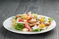 Caesar salad with chicken on oak table Royalty Free Stock Photo