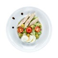 Caesar salad with chicken over white. With clipping path.