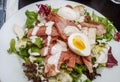 Caesar salad with crispy bacon, chicken and boiled egg Royalty Free Stock Photo