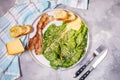 Caesar salad with crispy bread and bacon close up on concrete background Royalty Free Stock Photo