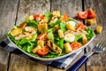 Caesar salad with grilled chicken, croutons, quail eggs and cherry tomatoes