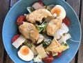 Caesar salad with grilled chicken, lettuce, cherry tomatoes, boiled egg, croutons, grated parmesan and yoghurt dressing. Royalty Free Stock Photo