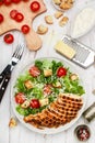 Caesar Salad with grilled chicken, lettuce iceberg, cherry tomatoes, croutons, Parmesan cheese and gourmet dressing Royalty Free Stock Photo