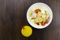 Caesar salad orange juice delicious healthy food tomatoes croutons Parmesan cheese and fresh mozzarella on wood background Royalty Free Stock Photo