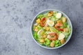 Caesar salad with prawn, roasted chicken,  croutons and cheese in blue bowl Royalty Free Stock Photo