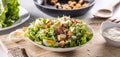 Caesar salad prepared from romaine lettuce, baked bacon, egg, bread croutons, garlic dressing and grated Parmesan cheese Royalty Free Stock Photo