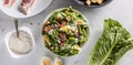 Caesar salad prepared from romaine lettuce, baked bacon, egg, bread croutons, garlic dressing and grated Parmesan cheese. Royalty Free Stock Photo
