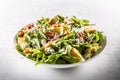 Caesar salad prepared from romaine lettuce, baked bacon, egg, bread croutons, garlic dressing and grated Parmesan cheese. Royalty Free Stock Photo