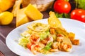 Caesar salad with shrimps on white plate Royalty Free Stock Photo