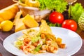 Caesar salad with shrimps on white plate Royalty Free Stock Photo