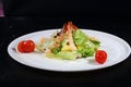 Caesar salad with shrimps on a white plate Royalty Free Stock Photo