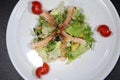 Caesar salad with shrimps on a white plate Royalty Free Stock Photo