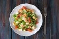 Caesar salad with shrimps in a white plate top view Royalty Free Stock Photo