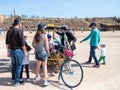 A participant of the Purim festival stands dressed in a fairy statue costume in Caesarea, Israel