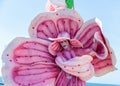 A participant of the Purim festival stands dressed in a fairy statue costume in Caesarea, Israel