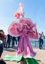 A participant of the Purim festival stands dressed in a fairy statue costume in Caesarea, Israel