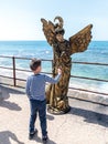 The visitor participates in the show of the participant of the Purim festival in Caesarea, Israel