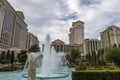 Caesars Palace Hotel, Casino and resort along the Las Vegas strip with tall lush green trees, water fountains, statues, blue sky Royalty Free Stock Photo