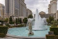 Caesars Palace Hotel, Casino and resort along the Las Vegas strip with tall lush green trees, water fountains, statues, blue sky Royalty Free Stock Photo