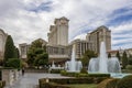 Caesars Palace Hotel, Casino and resort along the Las Vegas strip with tall lush green trees, water fountains, statues, blue sky Royalty Free Stock Photo