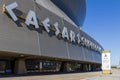 The Caesars Superdome with lush green trees and blue sky in New Orleans Louisiana Royalty Free Stock Photo