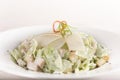 Caeser Salad with chicken fillet, white plate, brown background