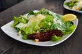 Caeser salad plate with caramelized beef Royalty Free Stock Photo