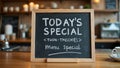 Caf chalkboard sign with Todays Special in bold and menu below Royalty Free Stock Photo