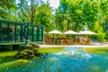 Cafe and an artificial pond in a park in Avignon, France