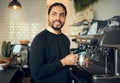 Cafe, barista and man at coffee machine milk steamer thinking with optimistic and happy smile. Professional coffee shop Royalty Free Stock Photo