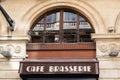 Cafe brasserie text sign word french means bar coffee on building city street restaurant classical