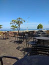 Cafe chairs and tables with seascape view