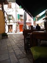 CAFE IN A COBBLESTONE STREET IN POREC, CROATIA