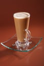 Cafe coffee Latte in a tall glass on brown Royalty Free Stock Photo