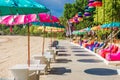 Cafe with colorful balinese umbrellas at beach in Bali, Nusa Dua. Beach club restaurant Royalty Free Stock Photo