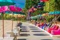 Cafe with colorful umbrellas at beach in Bali, Nusa Dua. Beach club restaurant Royalty Free Stock Photo