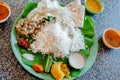 Cafe with food in Indian style. Rice and spicy vegetables, on palm leaf for dinner. Asian food still-life Royalty Free Stock Photo