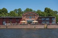 Cafe with guests on the bank of the trave river in lubeck, germany Royalty Free Stock Photo